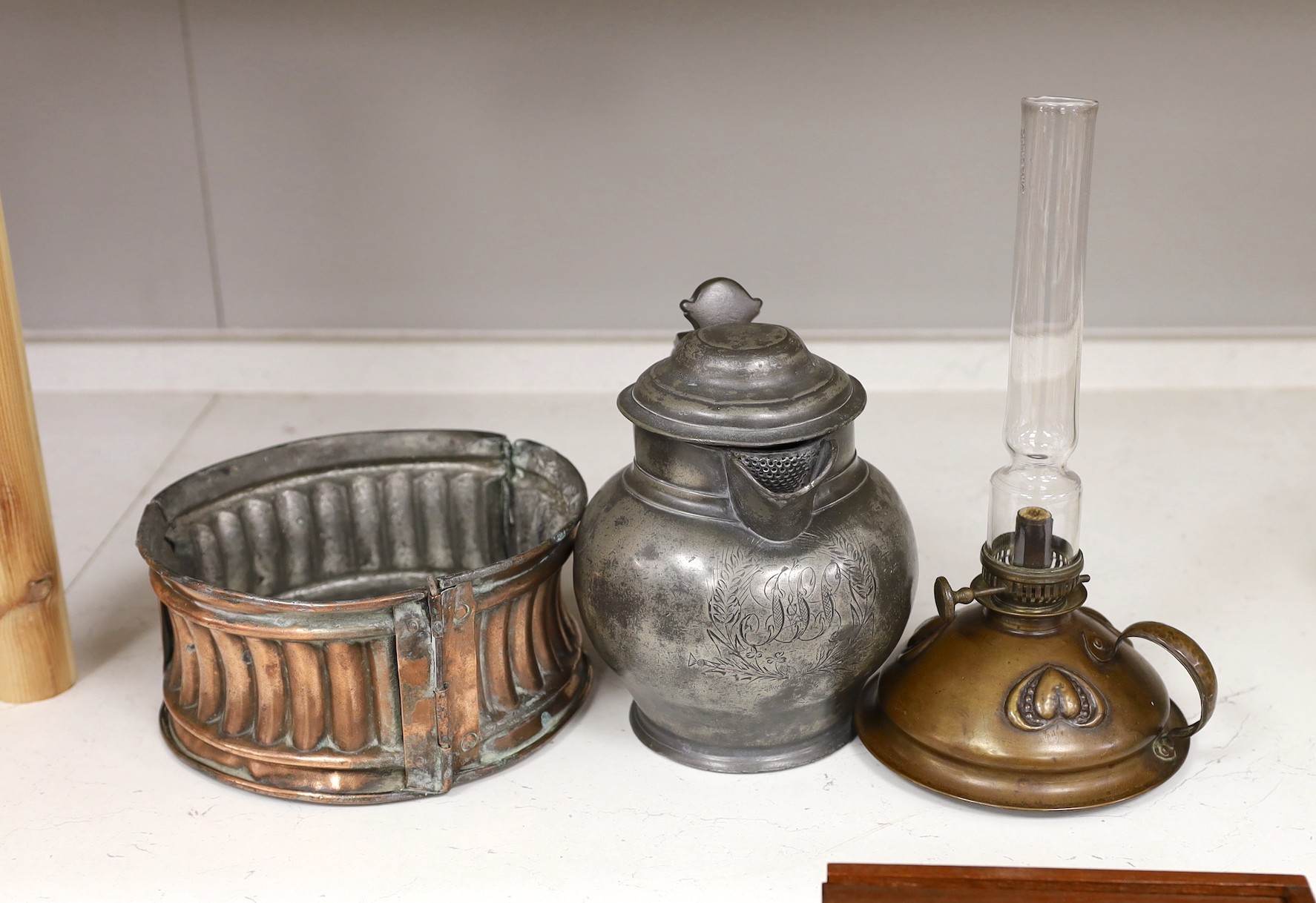 An unusual Victorian copper pie-mould, teak cased set of Bezique scorers, a brass link chain, a 19th century pewter pitcher, an Art Nouveau oil lamp, and two other items